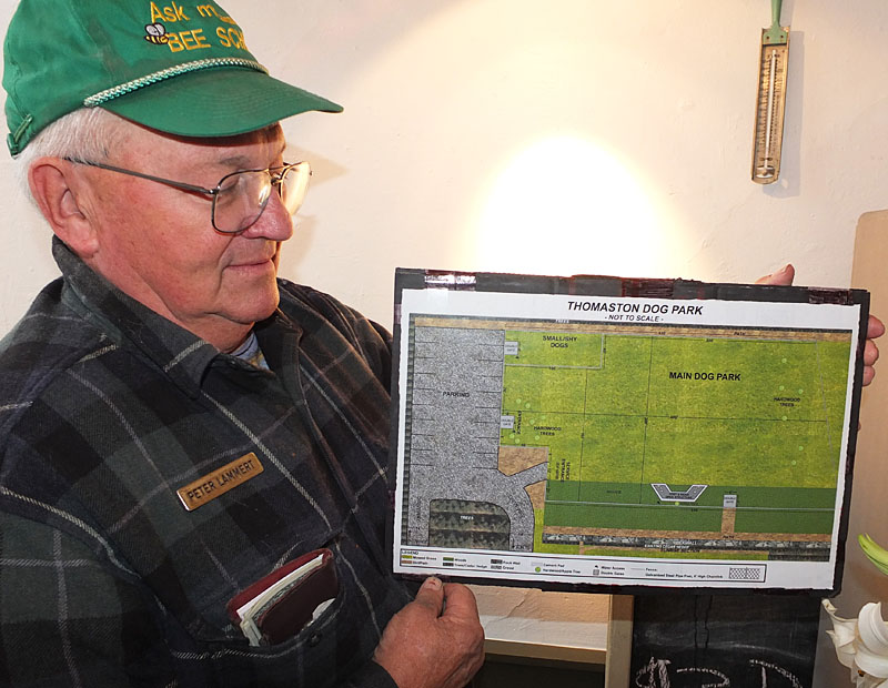 Peter Lammert displays the park layout.