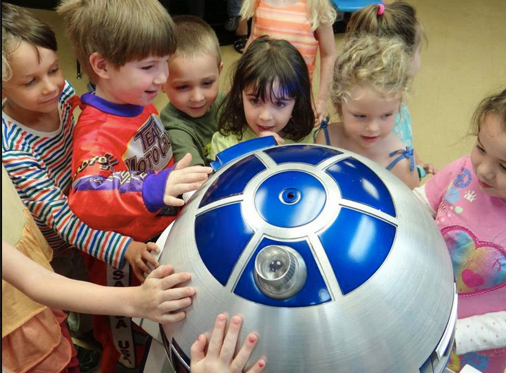 Kids are always very excited to touch R2-D2 and see how he works. (Photo courtesy Paul Bussiere)