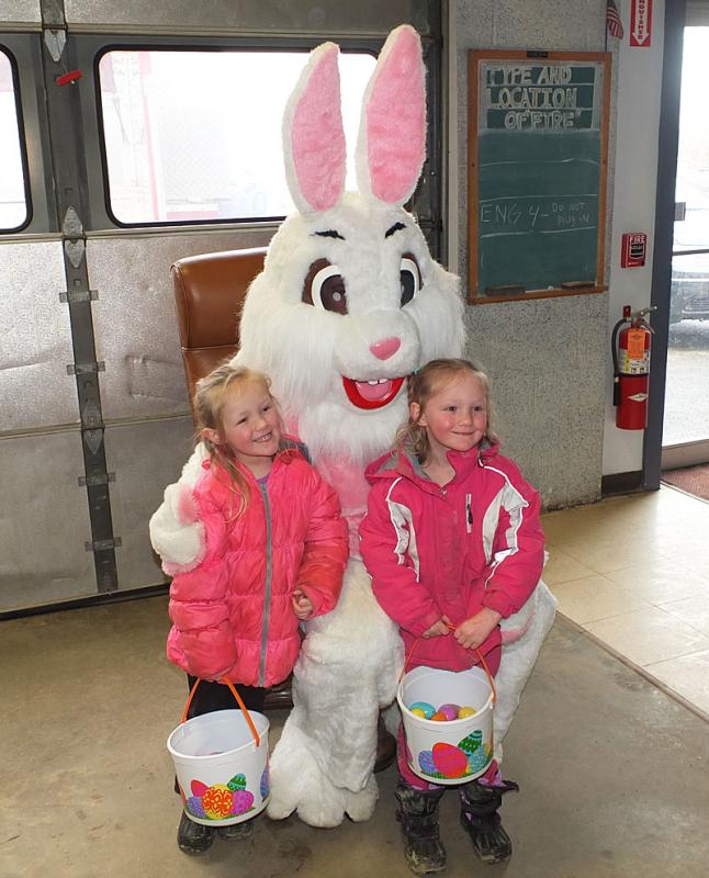 Two unidentified girls sat with the Eater Bunny.