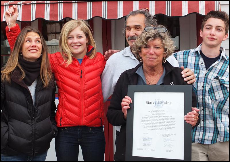 Meg Quijano (center) proudly display the proclamation given to her by state representative Joan Welsh. Behind her is her daughter Lisa Randall, granddaughter Yelena Randall, husband Paul Qiojano and grandson Oli Randall. (Photos by Chris Wolf)