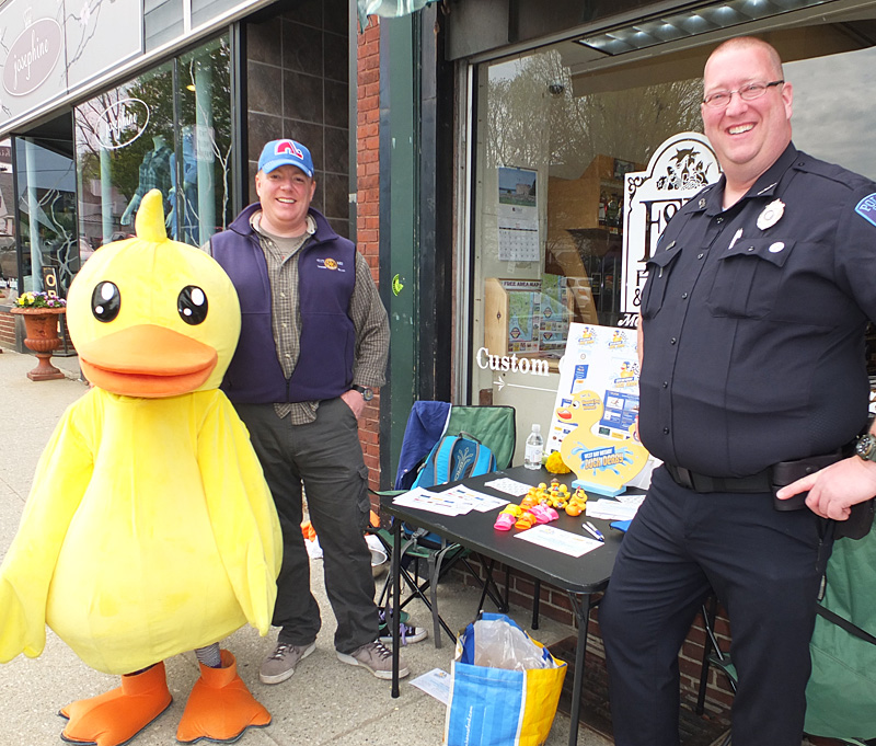 Scout Bookham (dressed as a duck), Dan Bookham and Camden Police officer Justin Hills.