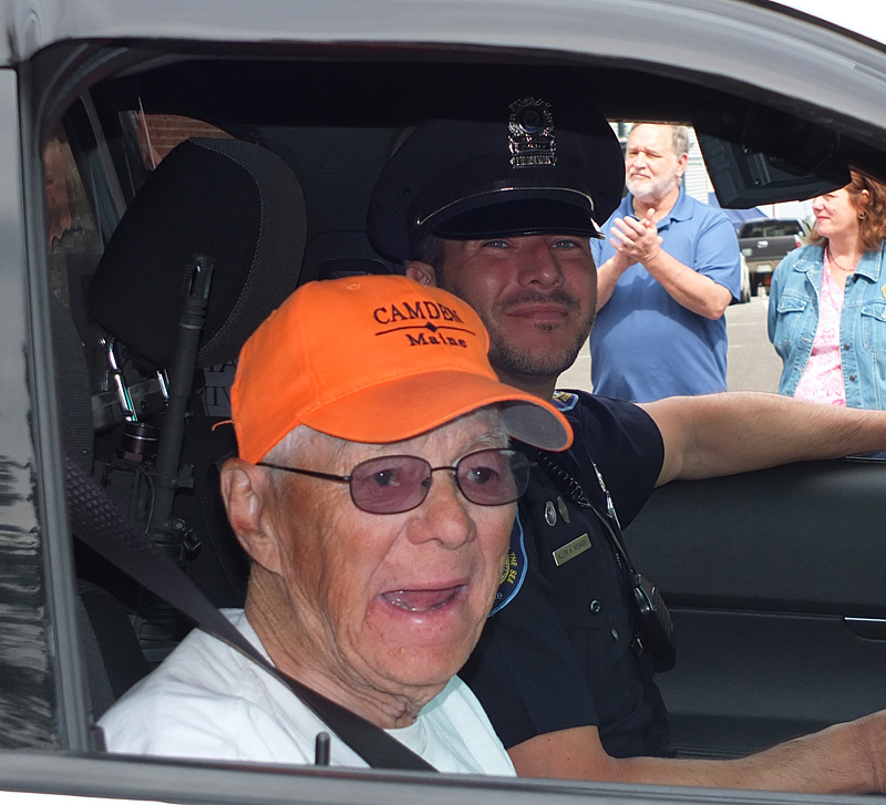 Kermit ‘Kert’ Ingraham, the waving man, leads Monday’s parade.