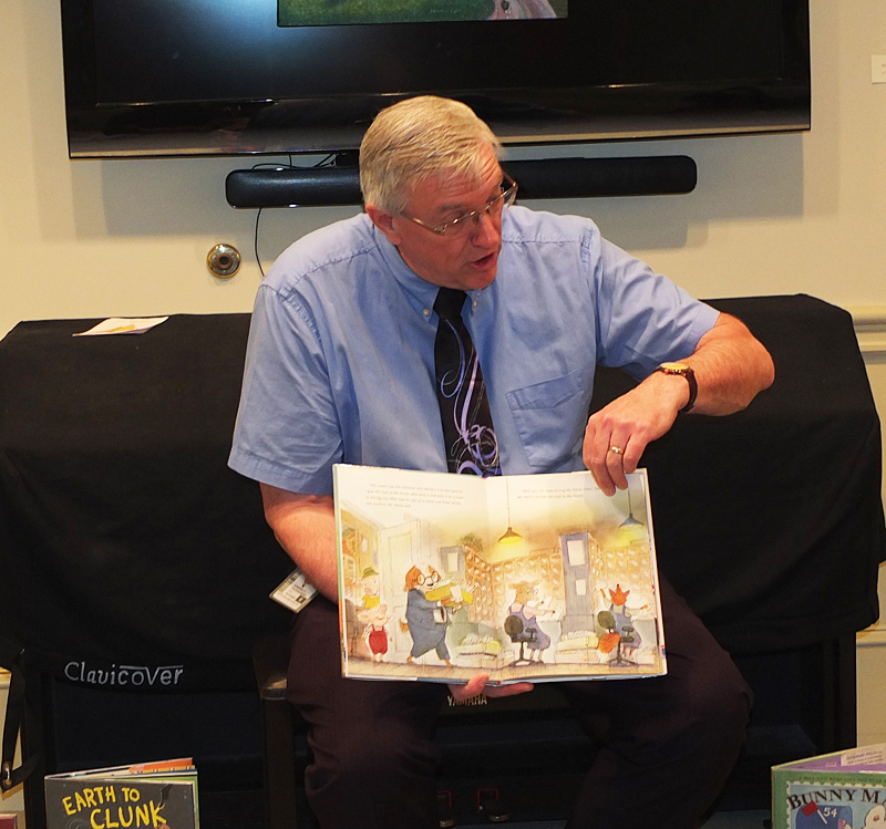 Steve Dalessandro took the time Saturday morning to read to the children at the Camden Public Library. He read a story about the post office of course.