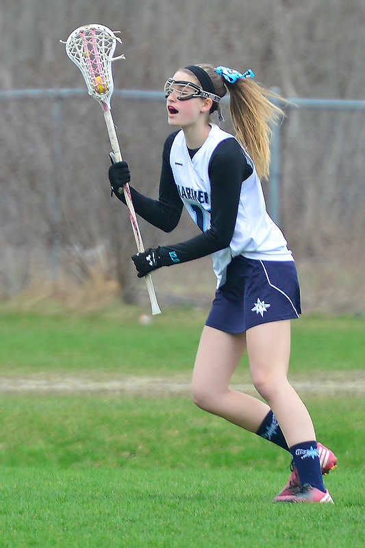 Oceanside’s Abbey Lacasse brings the ball up the field looking for an open teammate. (Photo by Ron Hawkes)