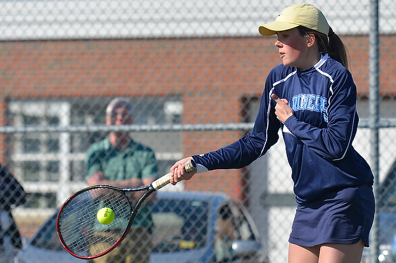 Oceanside’s Rebecca Boggs returns a volley during her second singles match Tuesday. (Photo by Ron Hawkes)