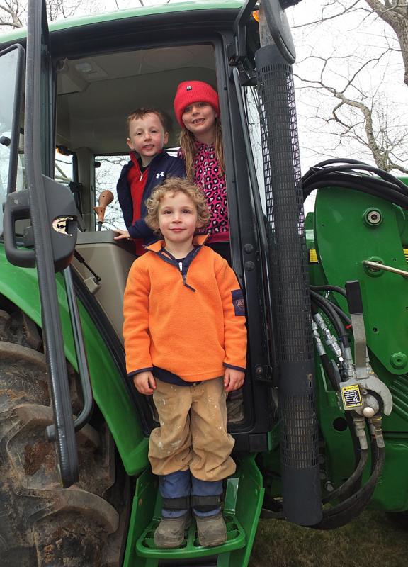 Three children, August Wells, Adela Brainard and Oscar Barnes exhaust themselves looking for the keys to the tractor. It was their fond desire to drive it around.