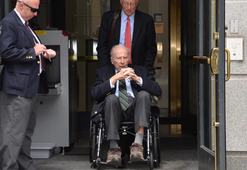 Russell ‘Rusty’ Brace is wheeled out of the U.S. District Courthouse on Federal Street in Portland just after noon, May 29, by his attorney, Peter DeTroy. (Photo by Lynda Clancy)