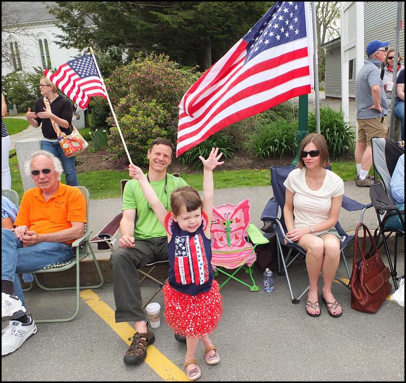 Alexa Watkins, with flag, welcomes the Memorial Day parade in downtown Camden along with her parents, Brian and Leslie, all of whom are from Rockport. (Photos by Chris Wolf)