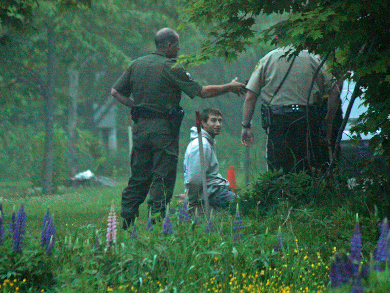 After finding Dylan Urquhart, armed with a loaded handgun, on foot between Union and Limerock streets near Coastal Opportunities, officers handcuffed him and continued their investigation into the incident. (Photo by Holly S. Edwards)