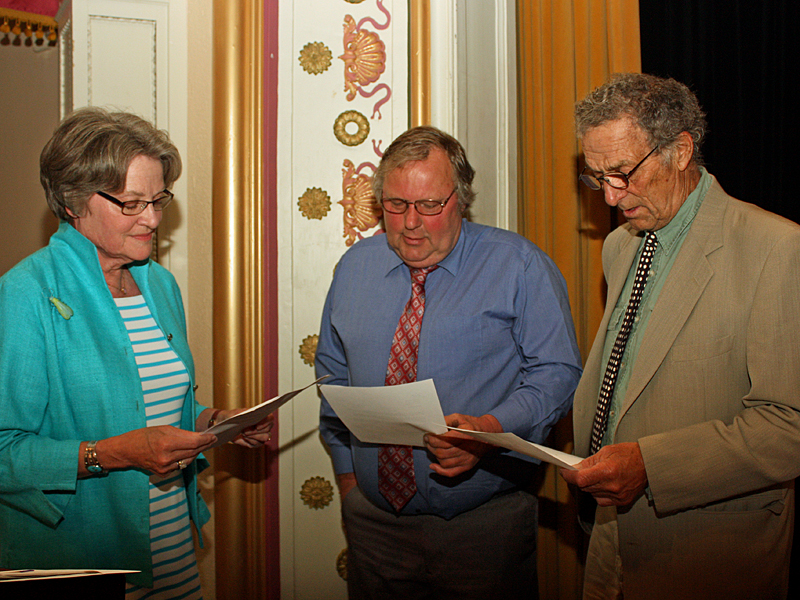 From left, June 2015 Town Meeting Moderator Deborah Dodge, John French and Leonard Lookner read and recite the oath of office as the two men are sworn back onto the Select Board, after having won election by popular vote June 9. (Photo by Holly S. Edwards)
