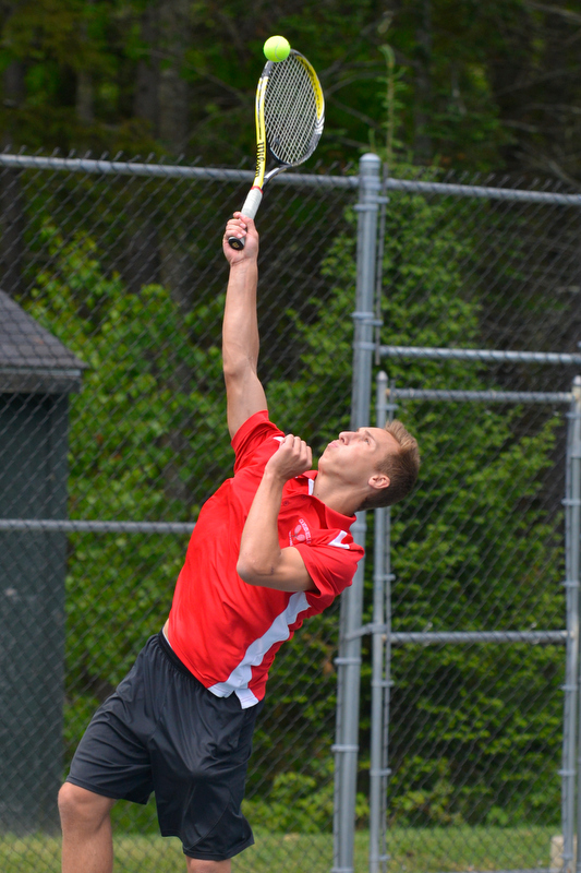 Camden’s No. 2 singles player Josiah Krul delivers a hard serve during his match Wednesday. (Photo by Ron Hawkes)