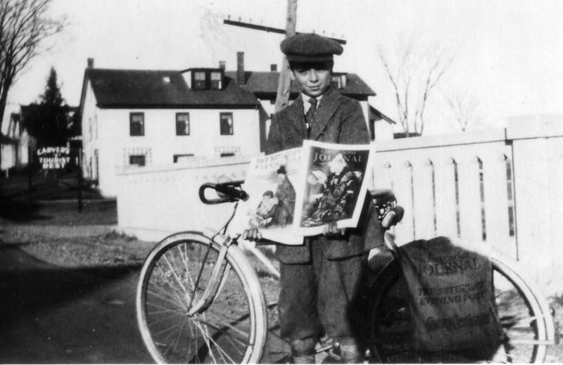 Young David Nichols, who went on to become a Maine Supreme Court Justice, displays copies of Grit, standing on Frohock Bridge; today’s Whales Tooth Pub is in the background.
Photo from the Lincolnville Historical Society david nichols