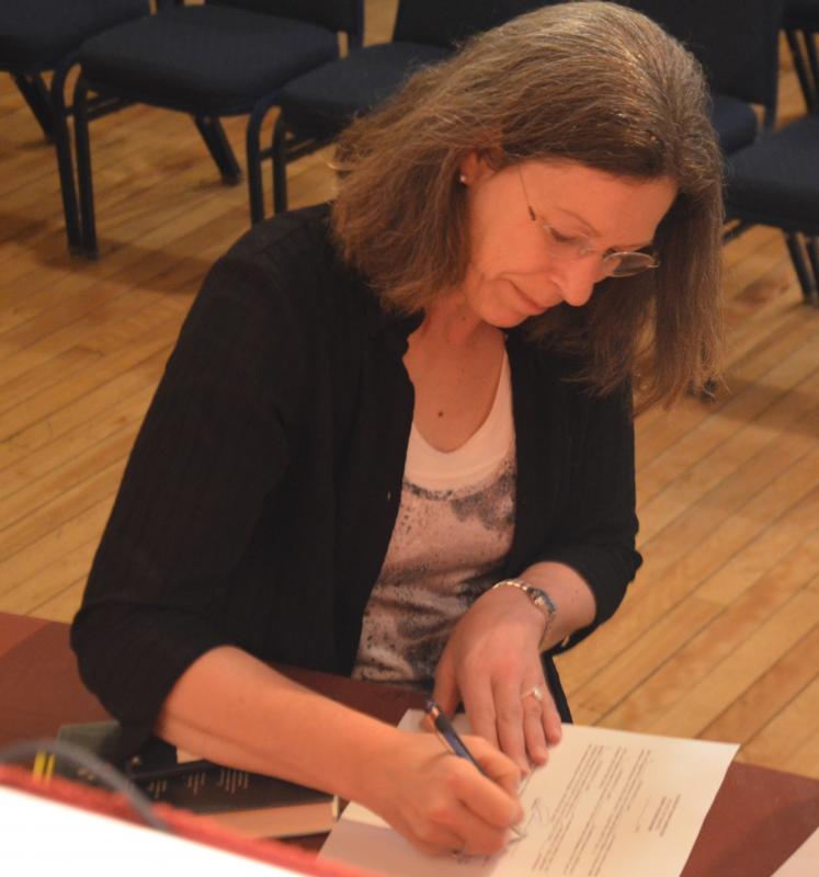 Stephanie Lash signs in for her second tour of duty on the Library Committee.