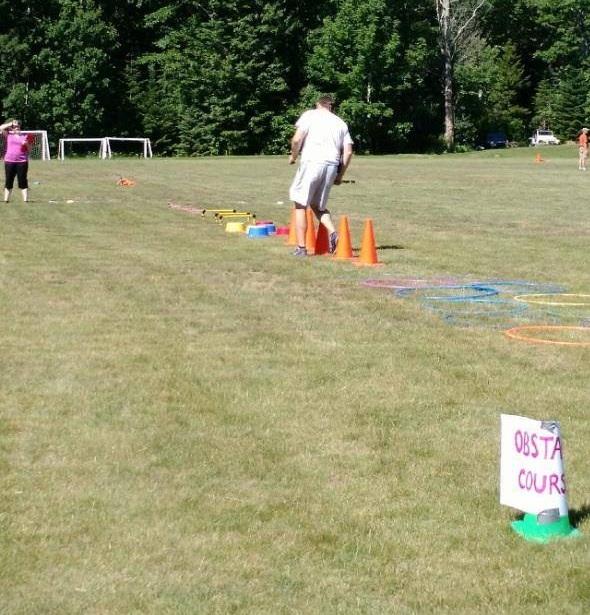 Lincolnville Central School P.E. teacher Nick DePatsy demonstrates the obstacle course. (Courtesy Jennifer Meservey Johnson)