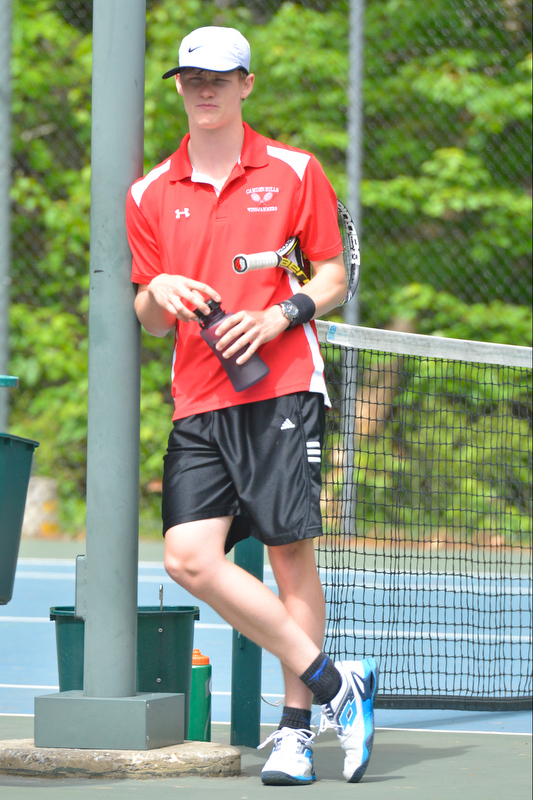 Camden’s Josiah Simko takes a break between sets of his no. 2 doubles. (Photo by Ron Hawkes)