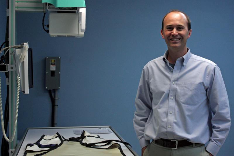 Dr. Bjorn Lee, veterinarian and owner of PenBay Veterinary Associates in Rockport, stands next to a new piece of X-ray equipment at the new Midcoast Animal Emergency Clinic on Route 90 in Warren. (Photo by Holly S. Edwards)