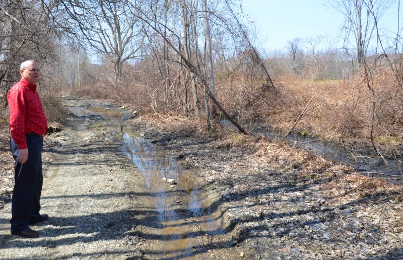 Lincolnville Town Administrator David Kinney stands in the 2,700-foot section of the Martin Corner Road that is proposed for municipal discontinuance. (Photo by Lynda Clancy)