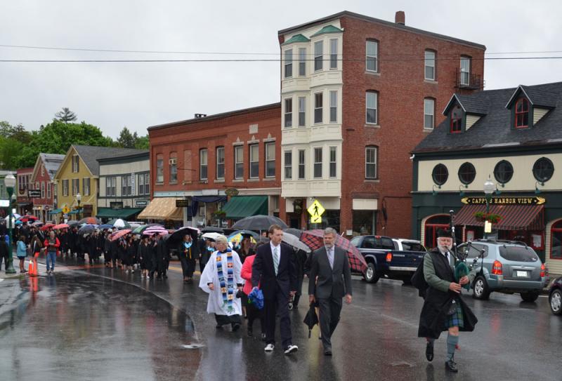 Under a light mist, the seniors of the Camden Hills Regional High School Class of 2015 made their way through downtown Camden and then up to the Congregational Church for baccalaureate. (Photo by Lynda Clancy)