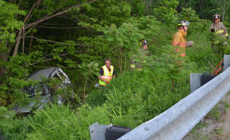A Jeep veered across Route 1 and rolled several times down an embankment before coming to rest against a stand of trees, Thursday evening, June 11. (Photo by Lynda Clancy)