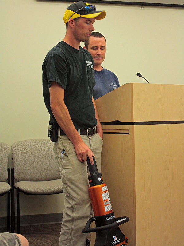 Lincolnville Fire Chief Ben Hazen, right, addresses the Board of Selectmen Monday night with firefighter A.J. Weed. (Photo by Holly S. Edwards)