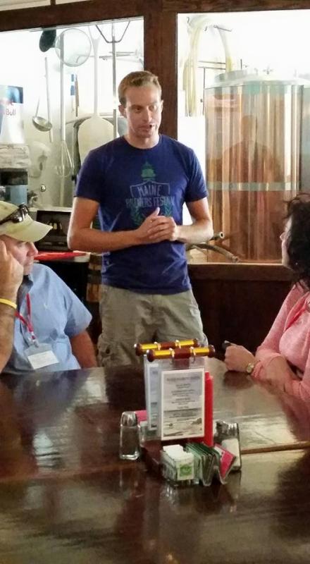 Dan Pease, brewer and owner of Rock Harbor Brewing Co. shares his story as guests await his pours. (Photo courtesy Robin McIntosh)