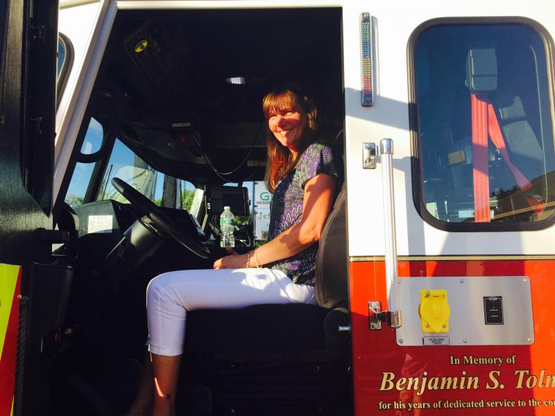 Krista Tolman, Ben’s wife, gets into the driver’s seat of the Ben Tolman truck. (Photo by Lynda Clancy)