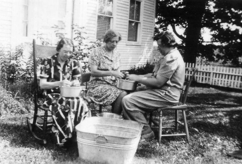 Shelling peas was another of those summer tasks where a visiting relative could be enlisted. Here a couple of visitors, perhaps sisters, help Bernice Calderwood.
Photo courtesy Lincolnville Historical Society
shelling peas