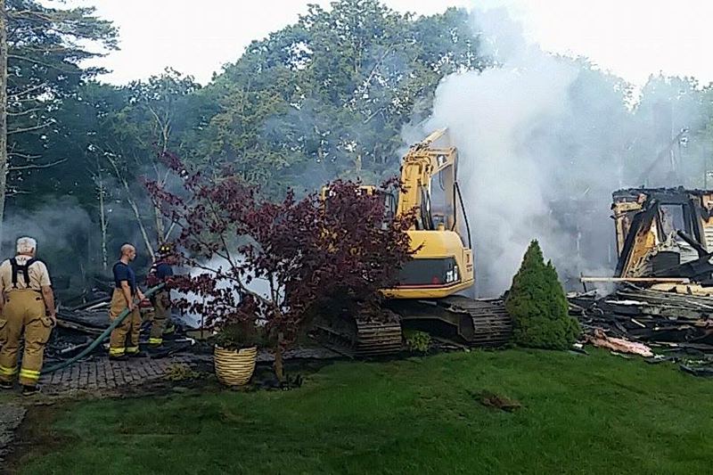 Union firefighters continue to douse the fire at 414 Payson Road hours after it first began, to put out hot spots. (Courtesy photo)
