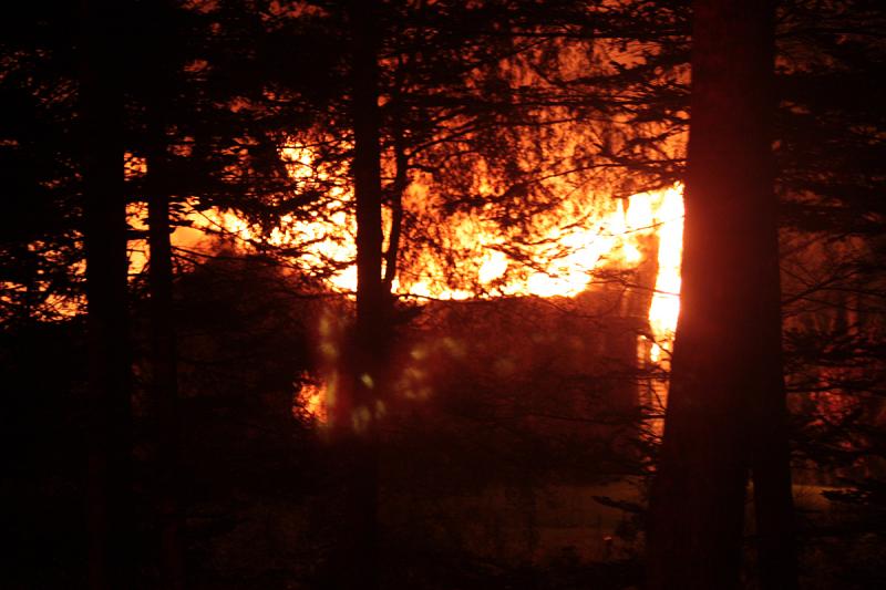 The glow and smoke from the Payson Road house fire early Tuesday morning could be seen from Route 17. (Photo by Holly S. Edwards)