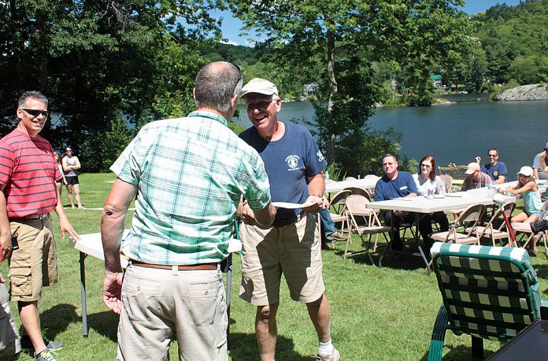 Camden firefighter Tom Bland is recognized for 40 years of service with the department. (Photo by Holly S. Edwards)