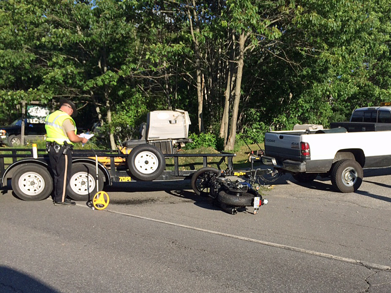 Knox County Sheriff’s Deputy Paul Spear takes notes and measurements while conducting an accident reconstruction in Warren early Thursday evening. (Photo by Holly S. Edwards)