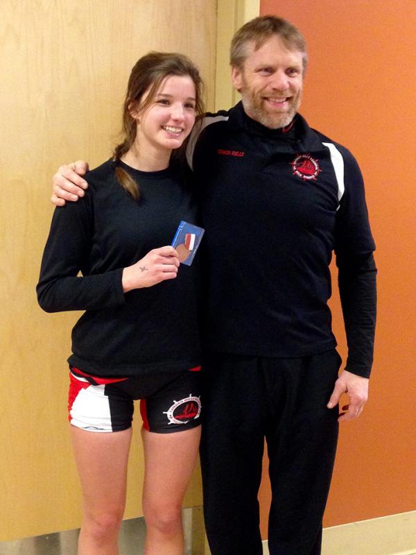 Hilary Merrifield and Camden Hills coach Patrick Kelly after Merrifield took third place in the State Class B championship tournament this past winter. (Photo courtesy Hillary Merrifield)