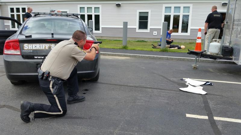 Tactical training with Sgt. Matt Elwell providing cover for an injured officer. (Photo by Sarah Shepherd)