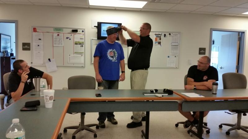Deputy Justin Hills, class instructor, demonstrates on Sgt. Ken Smith about how the tourniquet can hold the gauze hemostatic bandage in place for a head trauma injury. (Photo by Sarah Shepherd)