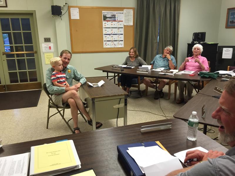 ReVision Energy’s Hans Albee and son Turner Albee, 3, meet with Wiscasset Planning Board members including, from left, Deb Pooler, Karl Olson and Jackie Lowell on Aug. 31 about a proposed solar farm. SUSAN JOHNS/Wiscasset Newspaper Hans Albee, Turner Albee, ReVision Energy, Wiscasset Planning Board, Deb Pooler, Karl Olsen, Jackie Lowell
