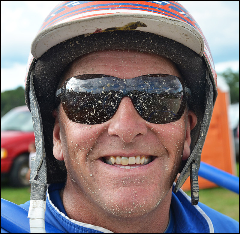 David Ingraham of Lewiston shows off the dust and dirt from the track after his race.