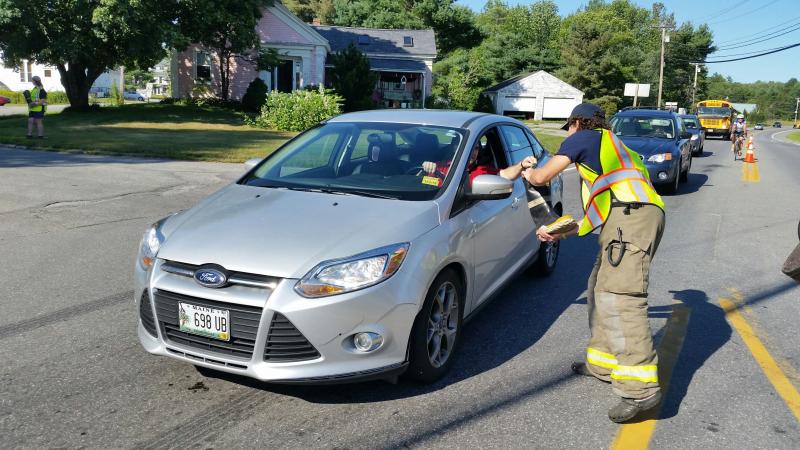 While his son, Levi Rollins, was busy at one part of Route 90, Greg Rollins was covering another part of the road. (Photo by Sarah Shepherd)