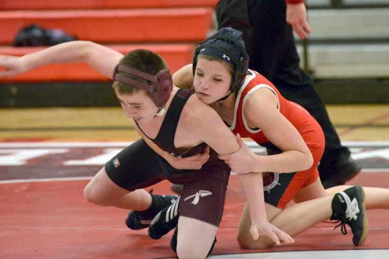 Hilary Merrifield wrestling Kolin Fraser from Nokomis back in 2013 as a freshman. (Photo by Ron Hawkes)