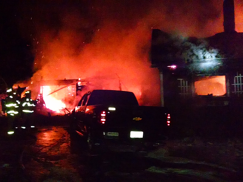 Firefighters from Lincolnville and Camden take a defensive stance against the house fire at 2 Virginia Drive in Lincolnville Saturday night that claimed the lives of wife and husband Virginia, 79, and Eugene,81, Dyer. (Courtesy Camden Fire Department)
