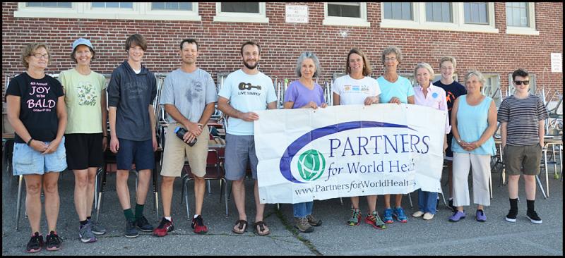 Left to right Maggi Massengale, head custodian; Cathy Straka, special ed; Sam Maltese, student; Aaron Henderson, Spanish teacher; Matthew Smith, assistant principal; Susan Silverio Spindlewood, Kristin Nelson, school nurse; Julie Waters, transportation director; Elizabeth McLellan, president Partners for World Health; Max Moore, student; Elphie Owen, math teacher, and Hugh Costigan, student, all participated in the effort on Friday.
