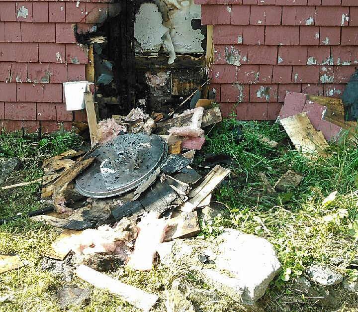 The aluminum lid, that reflecting sun onto cedar shingles and ignited a fire, lays among the debris from the fire. (Courtesy Searsmont Fire Department)