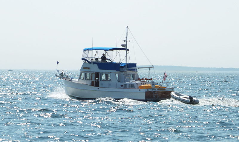 A pleasure boat heads out onto the bay.
