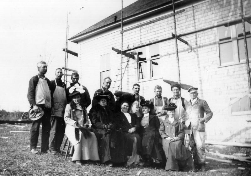 Workman and fund-raising women post next to what appears to be the doomed Grange the Second.
Photo courtesy of the Lincolnville Historical Society grange