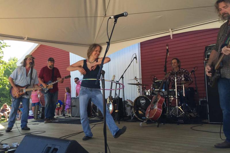 A hula hoop artist joined the action on the stage for a number. (Photo by Lynda Clancy)