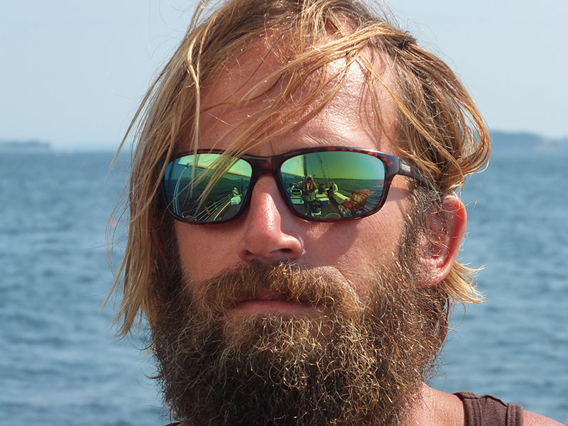 Laird Kopp takes a break from steering the vessel to allow a picture.