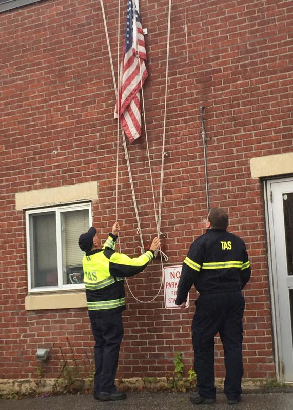 In Thomaston, the flag is raised at 8:40 a.m. (Photo by Lynda Clancy)