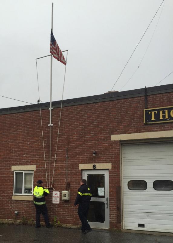 In Thomaston, the flag is raised at 8:40 a.m. (Photo by Lynda Clancy)