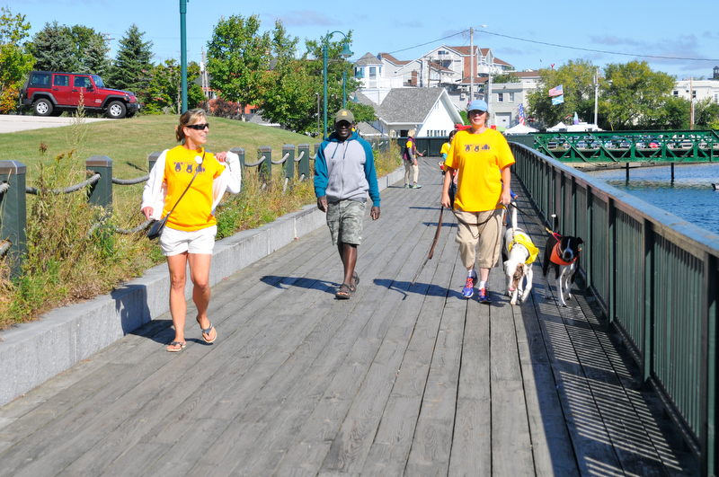 The walk along the Rockland Boardwalk was part of the one-mile dog walk. (Photo by Ron Hawkes)