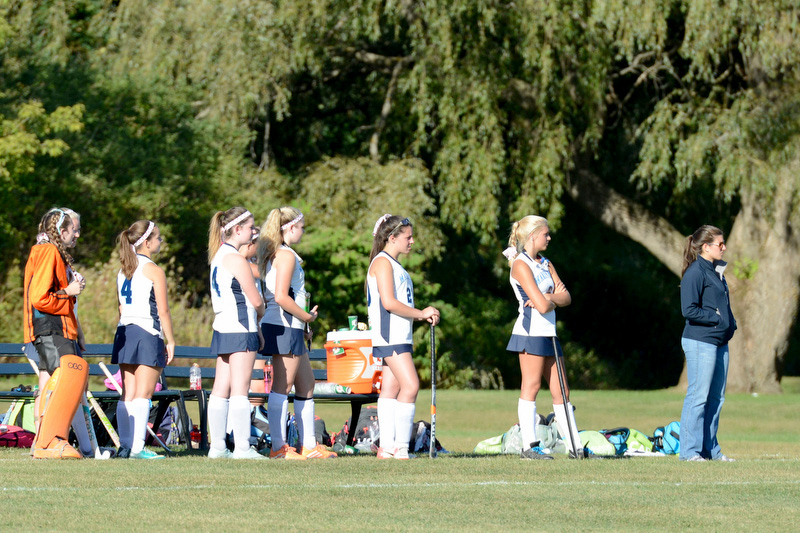 Oceanside assistant coach Samantha Willey and the bench intently was the action on the field. (Photo by Ron Hawkes)
