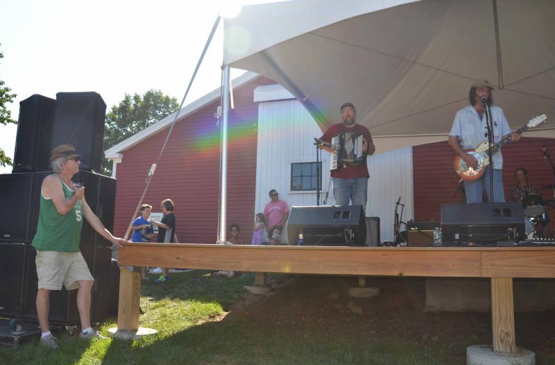 A Boston Celtics fan cozies up to the speakers to hear some Texas poetry . (Photo by Lynda Clancy)